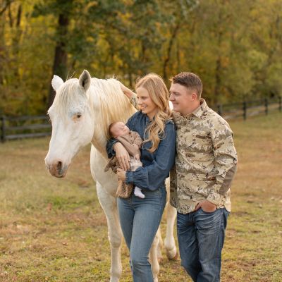 My family on our farm in KY. We are animal lovers! We have 2 horses, 2 dogs, and 2 cats!
